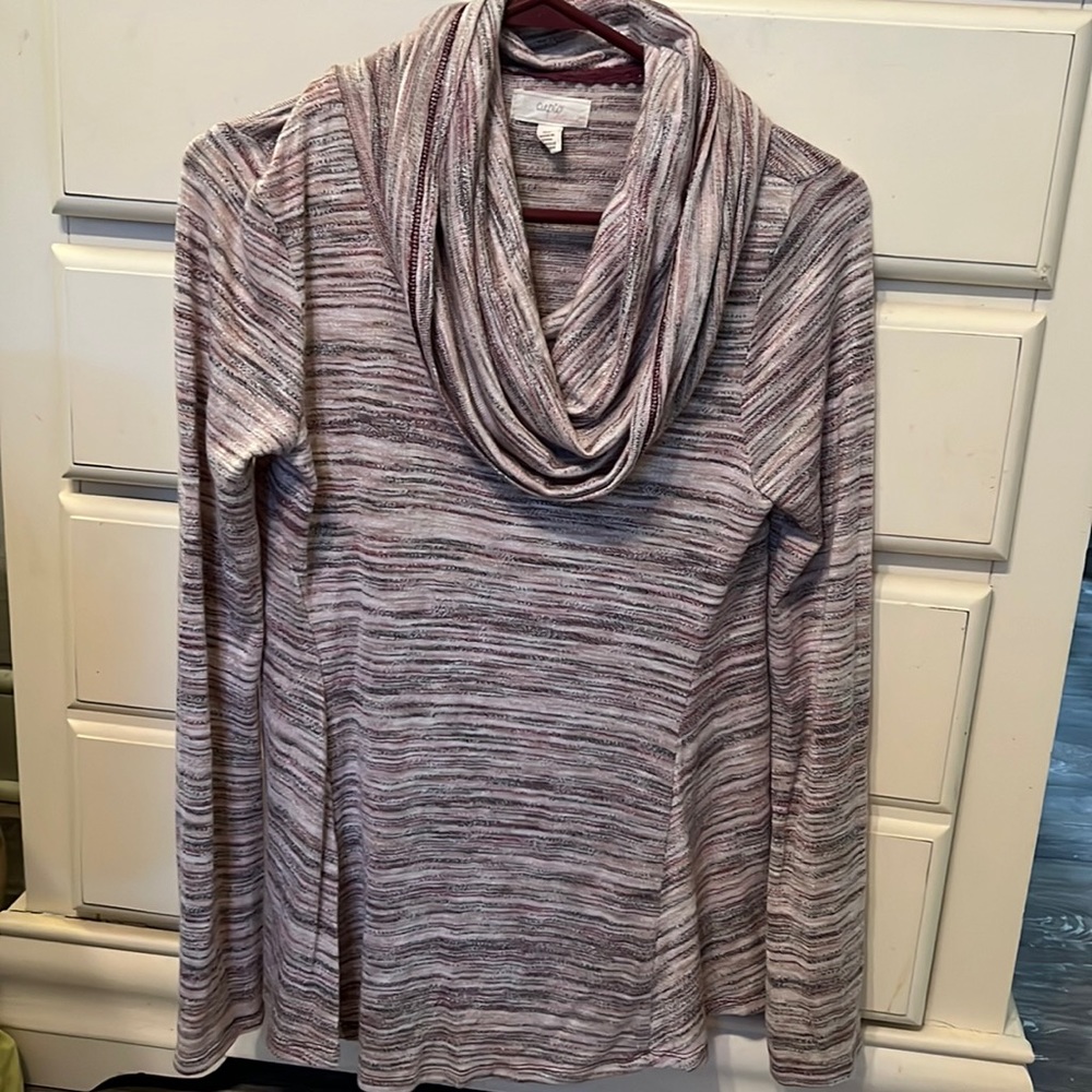 Super comfy, light weight shirt. Size Small but runs big.